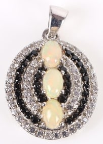 OVAL ETHIOPIAN OPAL, BLACK SPINEL & TOPAZ PENDANT