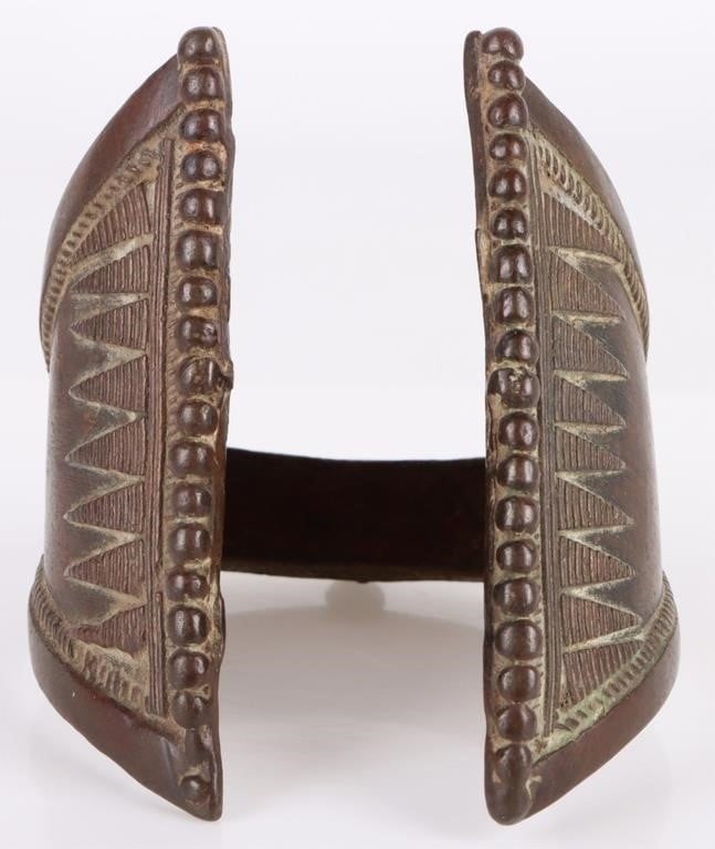 ANTIQUE AFRICAN TRIBAL BRONZE METAL BRACELET: Antique African tribal bronze metal bracelet known as a currency bracelet. The intricate design of the currency bracelet would have denoted that its wearer was a wealthy individual. Weight: 357.74 Con
