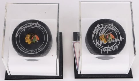 MARIAN HOSSA & ALEX DEBRINCAT AUTOGRAPHED PUCKS
