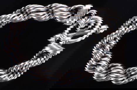 ESTATE MEXICAN STERLING SILVER ROPE BRACELET: This bold Estate bracelet is crafted from high-quality sterling silver and features a stunning thick rope twist design with a toggle clasp for secure wear. Made in Mexico, the bracelet showcases excep