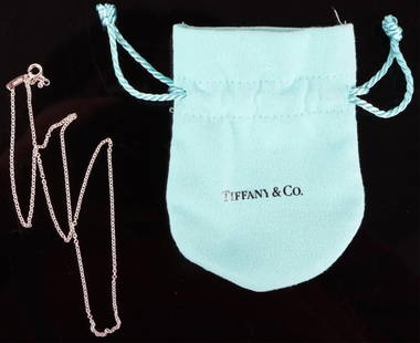 TIFFANY & CO STERLING SILVER CHAIN LADIES NECKLACE: Tiffany & Co. sterling silver chain ladies necklace to include the original pouch.Weight: 2.12 GramsSize: 16.25"Condition: Very fine.