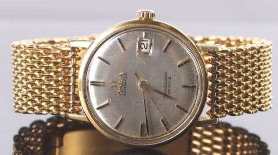 OMEGA SEAMASTER DE VILLE 18K GOLD AUTOMATIC WATCH: Omega Seamaster De Ville Gold Automatic Gentlemen's Watch. This elegant vintage timepiece from 1964 features a 18K solid Gold case, a classic silver dial with baton indexes. Equipped with 24 jewel aut