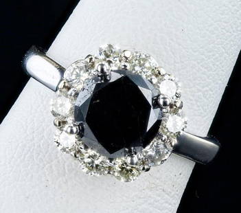 2.27CT BLACK CENTER DIAMOND 14K WHITE GOLD RING: One polished, stamped, and tested 14K white gold ring with a bright finish. The ring is mounted with 1 genuine black diamond center stone weighing approximately 2.27 carat, and 10 genuine round diamon