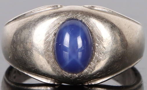 10K WHITE GOLD STAR SAPPHIRE LADIES RING: 10K white gold star sapphire ladies ring.Stone Type: SapphireWeight: 4.49 GramsSize: US 6.75Condition: Very fine.