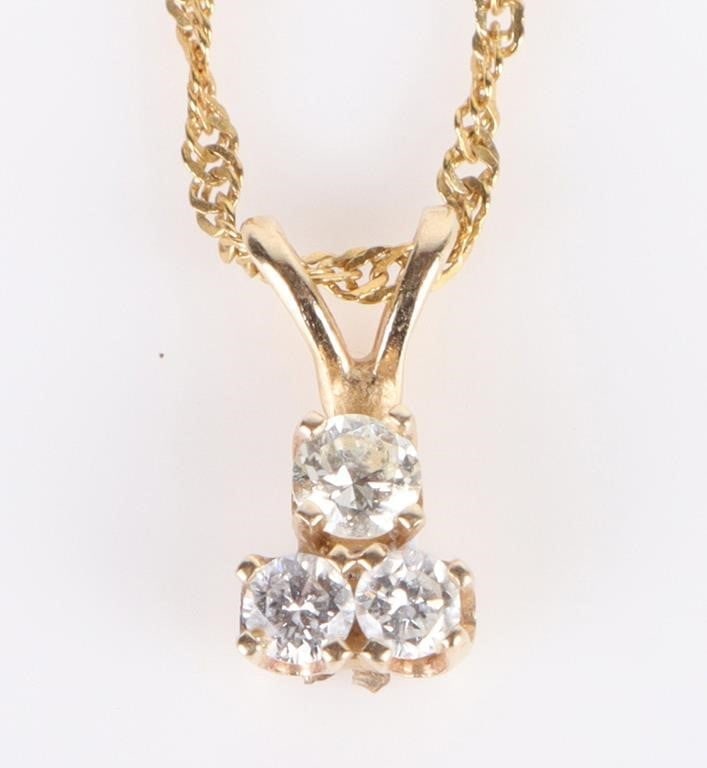 14K YELLOW GOLD SAPHHIRE LADIES NECKLACE: 14k yellow gold sapphire ladies necklace with three 0.06ct round white sapphires. Stone Type: Sapphire Weight: 1.74 Grams Size: 18" Length Condition: Very fine.