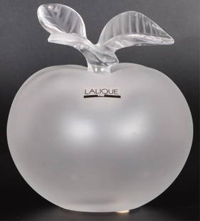 VINTAGE LALIQUE FROSTED GLASS APPLE PERFUME BOTTLE: Vintage Lalique frosted glass satin crystal apple "Pomme Eve" perfume bottle. Lalique signature found on the bottom of apple. Core is a stopper.Size: 5.50" X 5.50"Condition: Very fine.