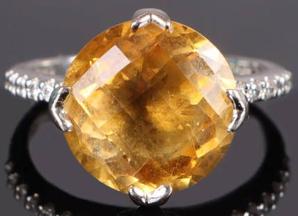 STERLING SILVER CITRINE CZ LADIES RING: Sterling silver citrine CZ ladies ring. Gemstones to include one 6.00ct round rose cut citrine, and eighteen 0.01ct round cut CZ.Stone Type: CitrineWeight: 4.20 GramsSize: 7.25 U.S.Condition: Very