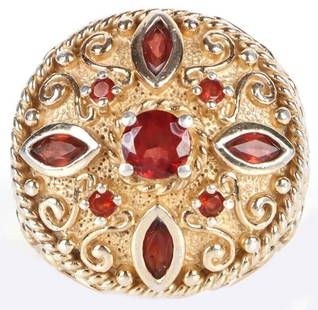 GARNET ORNATE GOLD-TONED STERLING SILVER RING: Garnet ornate gold-toned sterling silver ladies ring.Stone Type: GarnetWeight: 11.30 GramsSize: US 6Condition: Very fine.