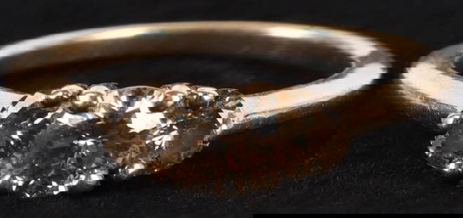 NATURAL 1.0CTW CHOCOLATE DIAMOND 14K YELLOW GOLD RING: 1.0CTW chocolate diamond 14k yellow gold ladies ring with one 0.50ct center round natural diamond and two 0.25ct round diamonds.Stone Type: DiamondWeight: 3.15 GramsSize: US 7Condition: Very fine.
