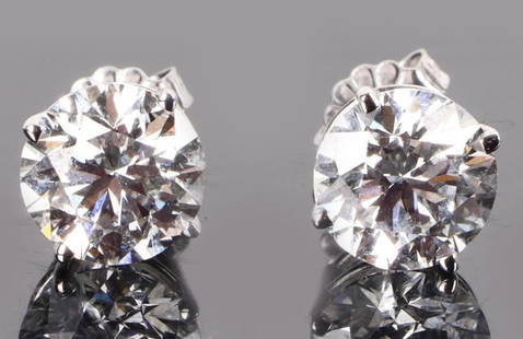 14K WHITE GOLD 4.09CT DIAMOND STUD EARRINGS IGI: 14K white gold 4.09CT lab diamond stud earrings IGI certified. Gemstones to include one IGI certified 2.05CT round cut VS-2 E color diamond, and one 2.04CT round cut VS-2 E color diamond. Also to incl