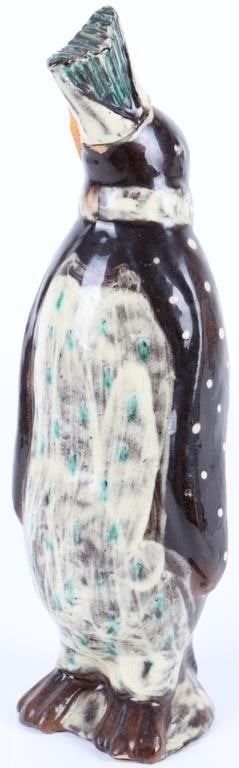 D. STUCKI HANDMADE CLAY PAINTED ANIMAL SCULPTURE: D. Stucki handmade clay painted animal sculpture to depict some kind of penguin. The cork connecting the beak and the head is broken. Not much is known about the artist D. Stucki.Size: 3.25" X 10.00"C