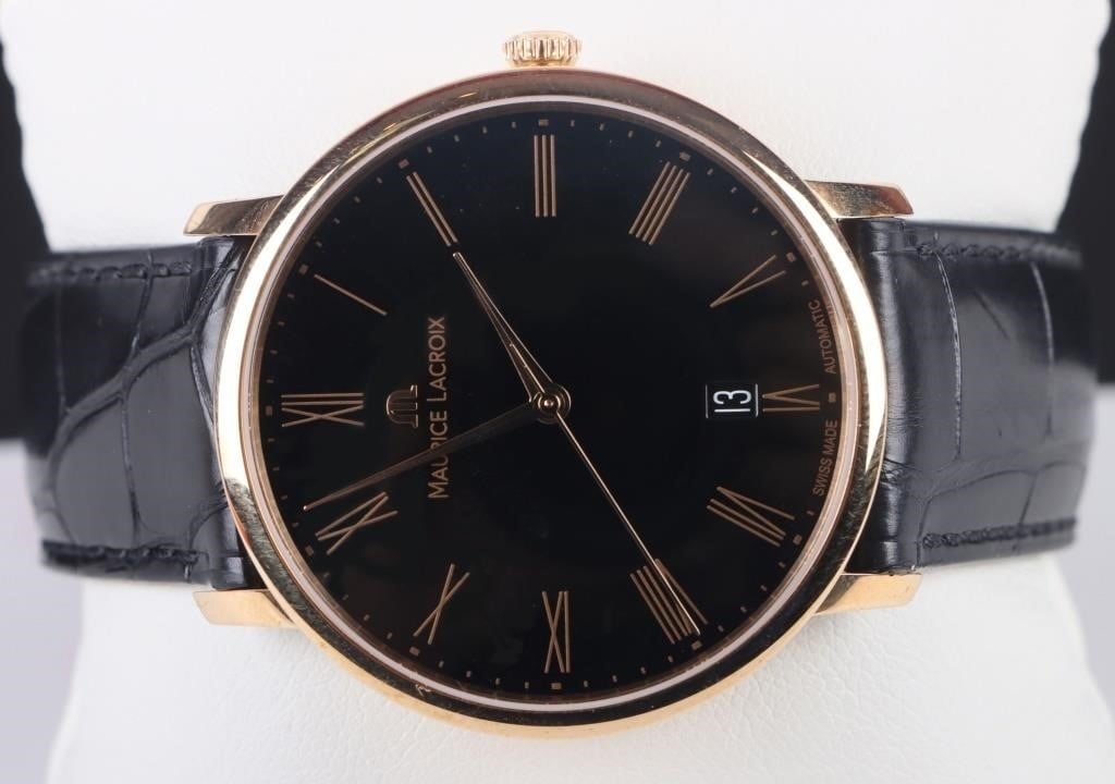 MAURICE LACROIX 18K GOLD SWISS MADE WRISTWATCH: Maurice Lacroix 18k Gold Swiss Made Wristwatch. To feature black dial with gold hands and hour markers. Gold Wristwatch Maurice Lacroix Mens Size: 38mm Condition: Very fine. See images.