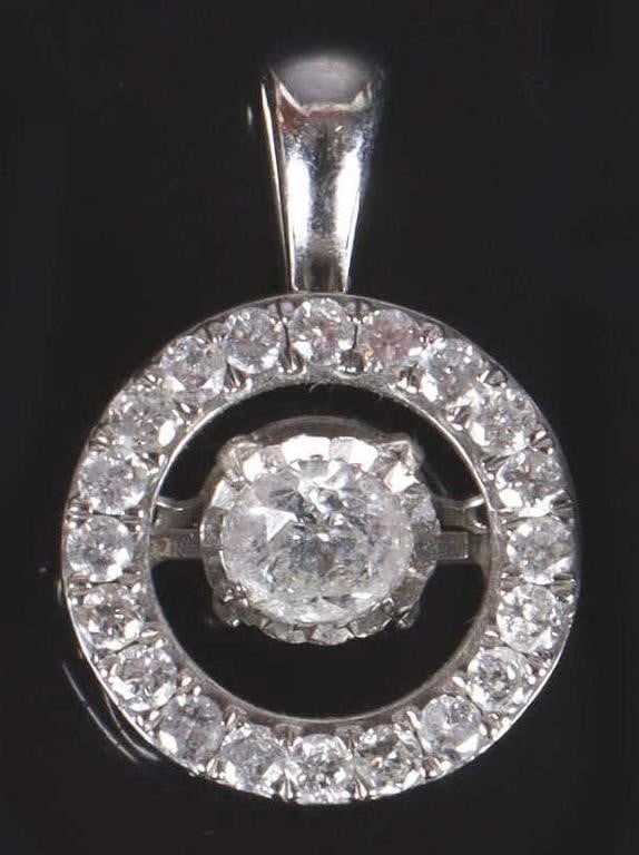 14K WHITE GOLD DIAMOND LADIES PENDANT: 14K white gold diamond ladies pendant. Gemstones to include one 0.33ct round cut diamond movable inside the ring of pendant, and twenty 0.02ct round cut diamonds Stone Type: Diamond Weight: 2.60 Grams