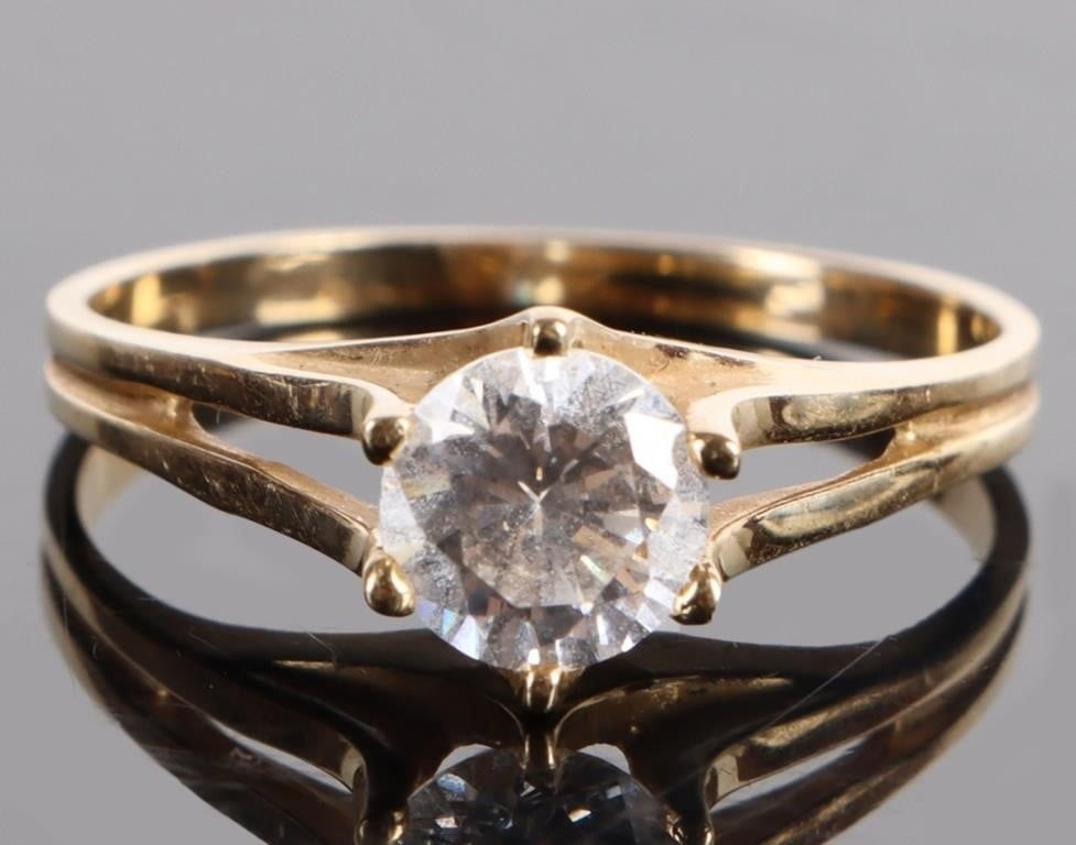 14K YELLOW GOLD CUBIC ZIRCONIUM LADIES RING: 14K yellow gold cubic zirconium ladies ring to include one 1.00ct round cut CZ. Stone Type: CZ Weight: 2.95 Grams Size: 9.50 U.S. Condition: Very fine.