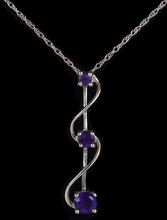 10K YELLOW GOLD AMETHYST PENDANT NECKLACE: 10k yellow gold necklace with Amethyst pendant. Pendant features 3 round cut Amethyst stones. Stone Type: Amethyst Weight: 1.6 grams Size: 19.5" Condition: Very fine.