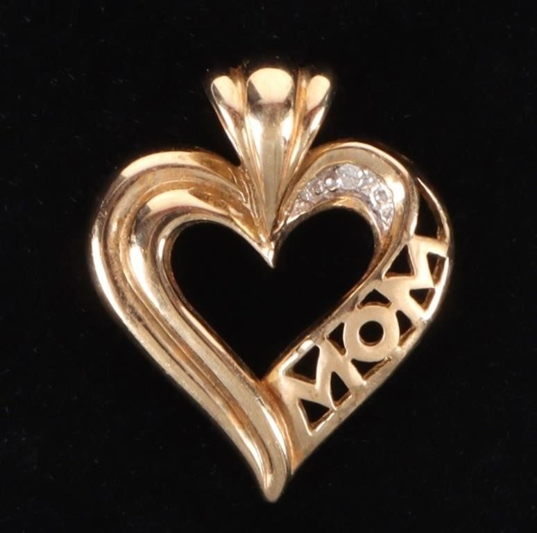 10K YELLOW GOLD 'MOM' DIAMOND HEART PENDANT: 10k yellow gold "Mom" diamond heart ladies pendant. With one 0.01ct round diamonds. Stone Type: Diamond Weight: 2.12 Grams Size: 0.75" Length Condition: Very fine.