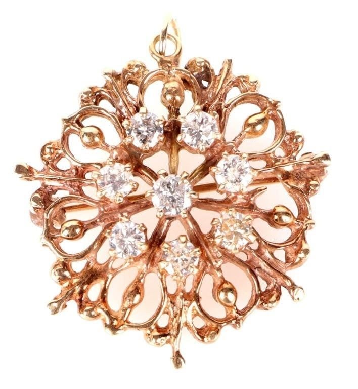 10K YELLOW GOLD NATURAL DIAMOND FILIGREE PENDANT: 10K yellow gold natural diamond filigree pendant. Gemstones to include seven 0.07ct round cut natural diamonds. Stone Type: Diamond Weight: 5.89 Grams Size: 1.25" Condition: Very fine.