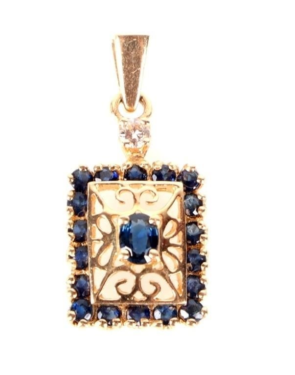 14K YELLOW GOLD DIAMOND LONDON BLUE TOPAZ PENDANT: 14K yellow gold diamond London blue sapphire filigree ladies pendant. Gemstones to include one 0.10ct oval cut blue topaz, eighteen 0.02ct round cut blue topaz, and one 0.04ct round cut diamond.Stone