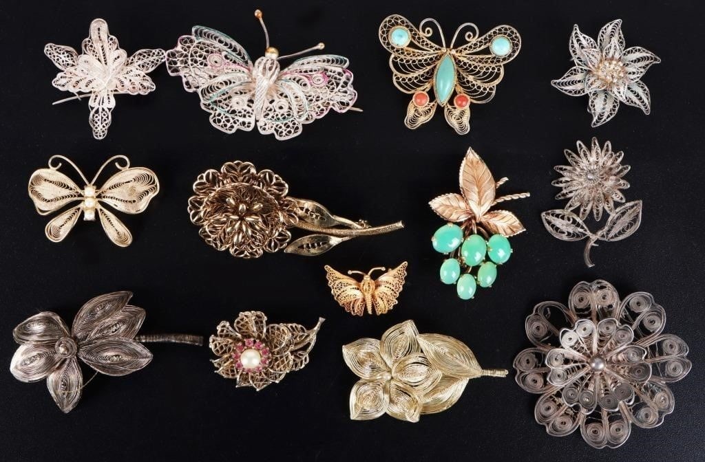 VINTAGE WIRE CRAFTED FASHION BROOCHES (13): Vintage wire crafted fashion brooches lot of 13 includes a variety of designs depicting butterfly and flora. Condition: Very fine. See images.