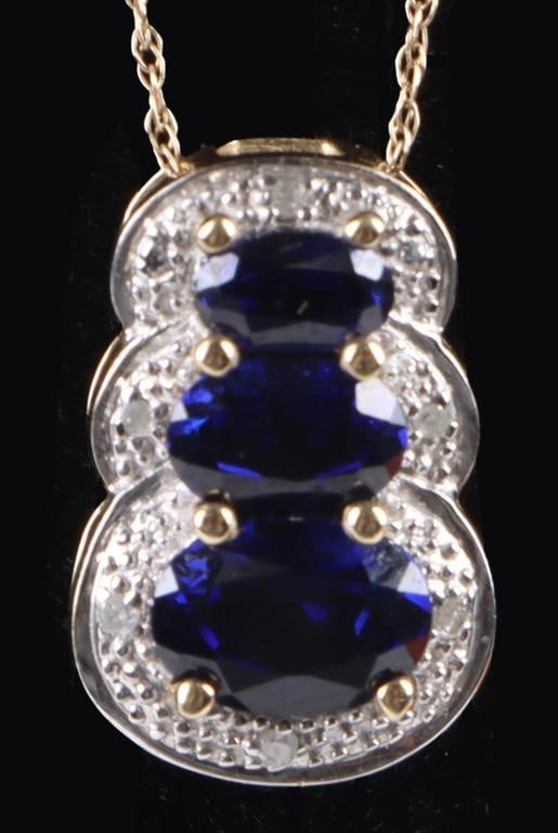 10K YELLOW GOLD BLUE SAPPHIRE DIAMOND NECKLACE: 10K yellow gold blue sapphire diamond ladies necklace with one 0.75CT oval sapphire, one 0.50ct oval sapphire, and one 0.20CT oval sapphire and six 0.01CT round diamonds. Stone Type: Sapphire Weight: 