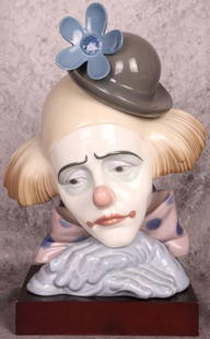 LLADRO #5130 RETIRED PENSIVE HEAD: Lladro #5130 retired pensive clown head with bowler hat on wooden base.Size: 11' H with baseCondition: Very fine