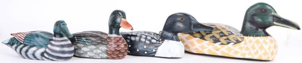 HAND-PAINTED & CARVED WOODEN DECOY DUCKS: Hand-painted and carved wooden decoy ducks. Ducks include two small painted ducks, one with teal details and one with orange and green details, one medium sized duck that has dark blue details, and on