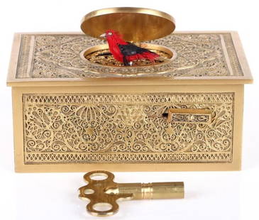 ELPA GOLD TONE SINGING BIRD MUSIC BOX: Beautiful ELPA gold tone singing bird music box. This beautiful filigree music box is a replica of the music box by Karl Griesbaum.Size: 4.25" x 1.75" x 2.75"Condition: Very Fine