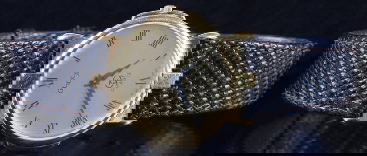 VINTAGE GUCCI 3400F M GOLD PLATED QUARTZ WATCH: Vintage Gucci 3400F M gold plated quartz men's watch. Swiss made with a black leather band.Gold plated Wristwatch Gucci MensSize: 30mmCondition: Functionality not tested.