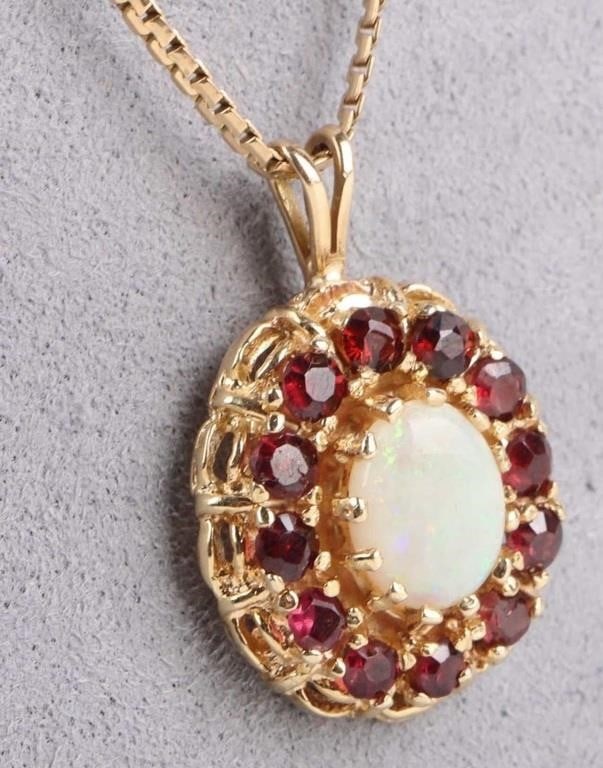 14K YELLOW GOLD CABOCHON OPAL LADIES NECKLACE: 14K yellow gold cabochon opal ladies necklace to include one 8.90 X 6.58 mm cabochon oval opal.Stone Type: AssortedWeight: 9.36 GramsSize: 21.00"Condition: Very fine.