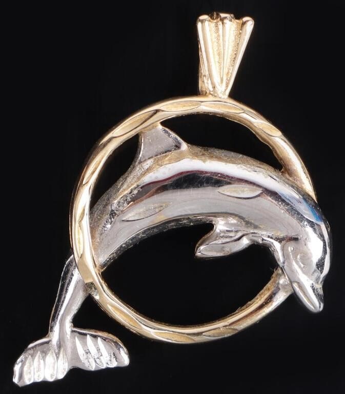 14K YELLOW & WHITE GOLD DOLPHIN PENDANT: 14k yellow and white gold dolphin pendant. Weight: 2.38 Grams Size: 0.75" length Condition: Very fine.