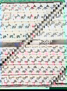 CHINESE MAHJONG GAME SET W/ EMBROIDERED SILK CASE: Chinese mahjong game set w/ivory colored tile set and embroidered silk case. Tiles are still in plastic.Condition: Very Fine GAME