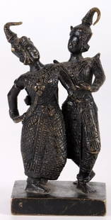 BRONZE THAI- SIAMESE DANCING COUPLE SCULPTURE: Bronze Thai-Siamese dancing couple sculpture. This sculpture is of a couple in the traditional attire. The sculpture is intricately detailed showing the fine designs of the traditional attire on the c