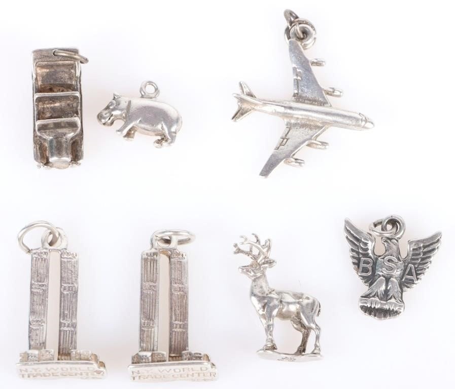 STERLING SILVER SOLID BRACELET CHARMS - (7): Sterling silver solid bracelet charms to include seven charms. Weight: 22.50 Grams Size: 1.0 Grams Condition: very fine.