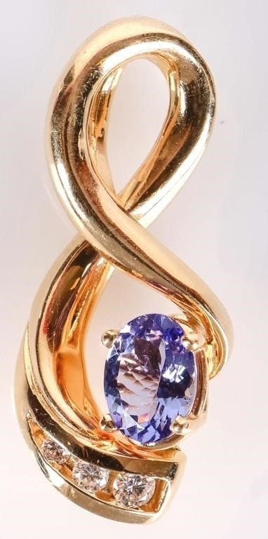 14K YELLOW GOLD TANZANITE DIAMOND LADIES PENDANT: 14K yellow gold tanzanite diamond ladies pendant. Gemstones to include 1.00ct oval cut tanzanite, one 0.07ct round cut diamond, one 0.04ct round cut diamond, and one 0.02ct round cut diamond.Stone Typ