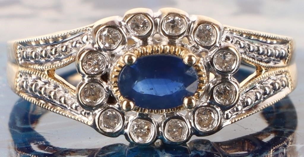 SAPPHIRE & DIAMOND 14K YELLOW GOLD ORNATE RING: Sapphire and diamond 14k yellow gold ornate ring with one 0.50ct oval sapphire and twelve 0.02ct round diamonds. Stone Type: Assorted Weight: 4.29 Grams Size: US 8 Condition: See pictures.