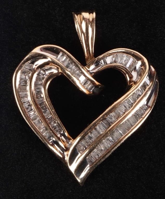 ~1.42CTW DIAMOND & 10K GOLD LADIES HEART PENDANT: ~1.42CTW channel cut diamond heart pendant set in 10K yellow gold. Stone Type: Diamond Weight: 4.0 Grams Size: 1.25" Condition: Very fine