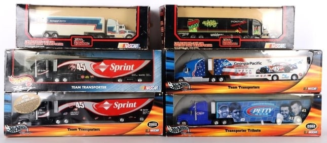 ASSORTED TEAM TRANSPORTER DIE CAST SEMIS (6)