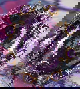 30CT AMETHYST & TOPAZ STERLING SILVER LADIES RING: 30ct amethyst and topaz sterling silver cocktail ladies ring with eight 0.25ct trillion-cut blue topaz and eight 0.15ct round amethyst.Stone Type: AssortedWeight: 14.50 GramsSize: US 8.5Condition: