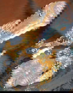 WHITE CARVED LABRADORITE STERLING SILVER RING: White carved floral labradorite sterling silver gold-tone ladies ring with small peridot gemstones.Stone Type: AssortedWeight: 8.62 gramsSize: US 8Condition: New.