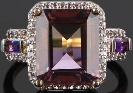 5.0CT AMETRINE STERLING SILVER LADIES RING: 5.0ct Ametrine sterling silver ladies ring with gold tone and cubic zirconium.Stone Type: AssortedWeight: 4.64 GramsSize: US 7.25Condition: Some tarnishing, see images.