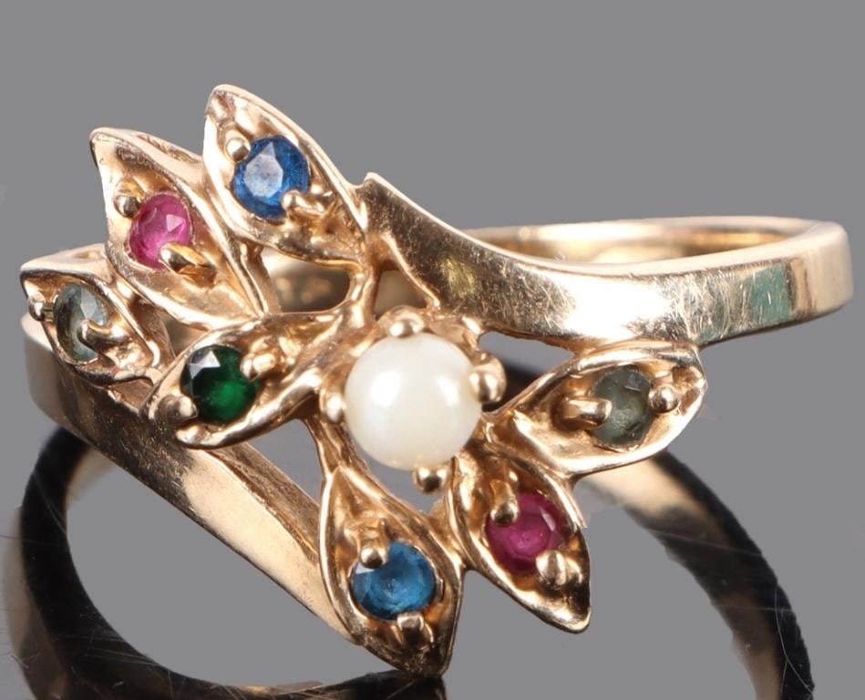 10K YELLOW GOLD GEMSTONE LADIES RING: 10K yellow gold gemstone ladies ring with seven 0.02CT round spinel, topaz, and emerald and one white pearl.Stone Type: AssortedWeight: 3.71 GramsSize: US 7.75Condition: Very fine.