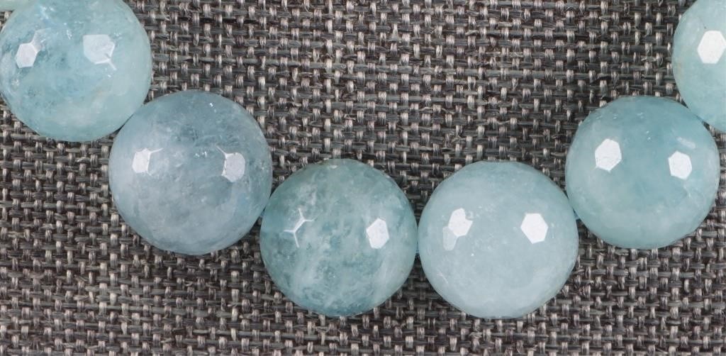 AQUAMARINE 12.7-13.2MM BEADED LADIES NECKLACE: Aquamarine 12.7-13.2mm beaded ladies necklace with thirty-five aquamarine beads.Stone Type: AquamarineWeight: 85.7 GramsSize: 18" lengthCondition: Very fine.