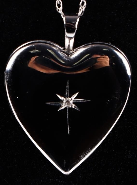 14K WHITE GOLD DIAMOND HEART LOCKET NECKLACE: 14K white gold diamond heart locket necklace. Gemstones to include one 0.01ct round cut diamond.Stone Type: DiamondWeight: 4.62 GramsSize: 18.00"Condition: Like new, see images for details.