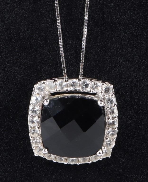 10K GOLD ONYX & TOPAZ PENDANT W/ 14K GOLD CHAIN: 10k white gold onyx and topaz pendant with one 14k white gold chain necklace.Stone Type: AssortedWeight: 4.30 GramsSize: 18" lengthCondition: Very fine.