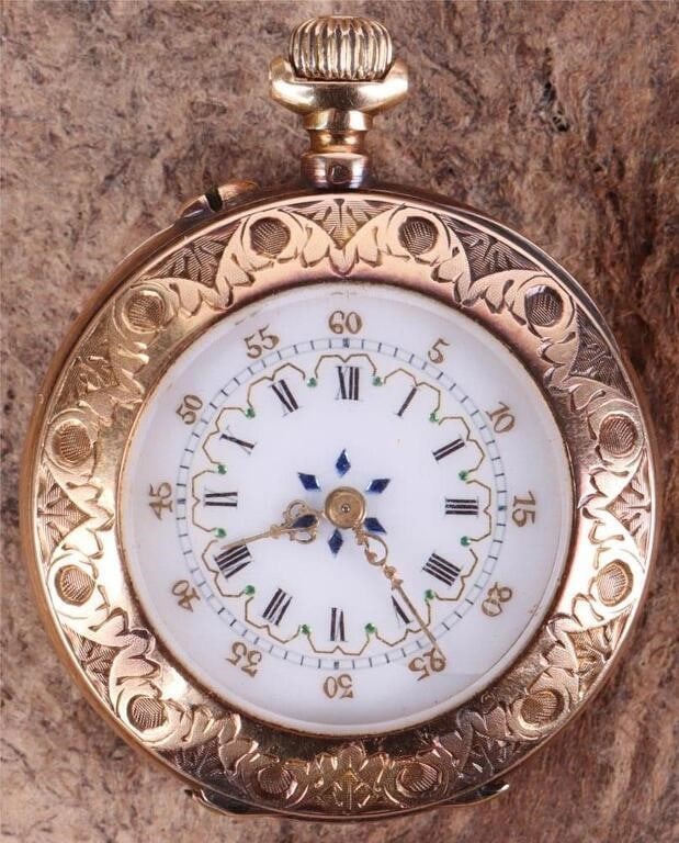 18K ORNATE WATCH PAINTED FACE ETCHED CASE FUNCTION: 18k yellow gold antique pocket watch. The face has gold-tone paint and metallic paint to imitate precious stones. The case is intricately carved throughout with an initial on the back. The number of j