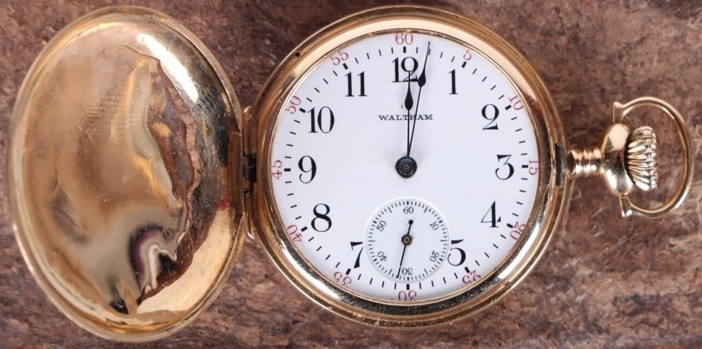 WALTHAM 14K YELLOW GOLD STOPWATCH FUNCTIONAL: Waltham 14K yellow gold stopwatch. The front lid features vegetative motifs, a crest, and geometric etching. The number of jewels is unknown.Yellow Gold Waltham MensWeight: 28.96 gramsSize: 32.8 mmCon