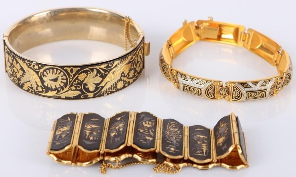 GOLD-TONED LADIES CLOISONNE BRACELETS (3): Gold-toned Asian-styled cloisonne ladies bracelets. Included is one gold-toned bracelet with figural designs (storks on stones, houses, etc), one with vegetative designs, and one with white outlines a