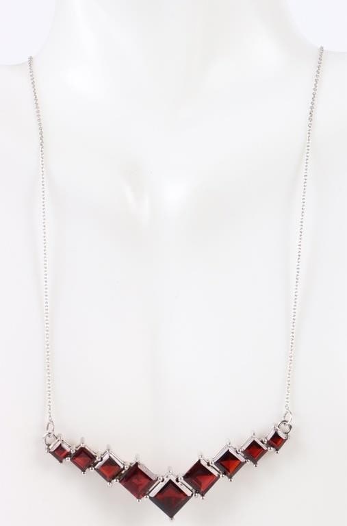GARNET STERLING SILVER LADIES NECKLACE: Garnet sterling silver ladies necklace with 9.0CTW princess-cut garnets.Stone Type: GarnetWeight: 8.28 GramsSize: 18" lengthCondition: Very fine.