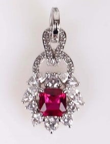 LADIES PENDANT W/ 0.5CT RUBY AND WHITE STONES