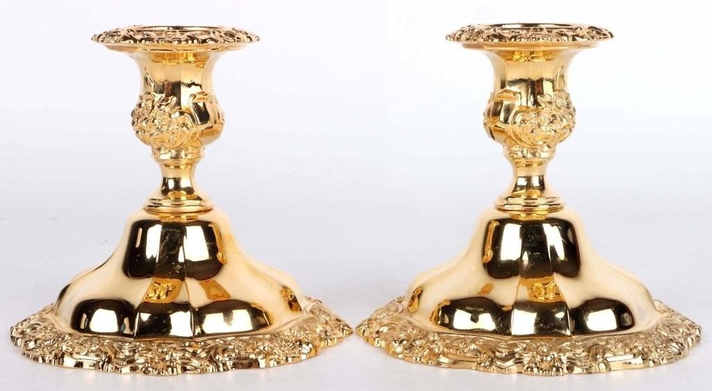 INTERNATIONAL SILVER COUNTESS 23K CANDLE HOLDERS 2: Lot of two International Silver Countess branded 23K gold-plated squat wide-based candle holders. Both are finely crafted in an elaborate Baroque style. Both pieces combined are 2.9 lbs.Size: 5" X 5"
